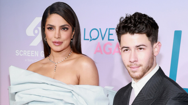Priyanka Chopra and Nick Jonas pose together at an event