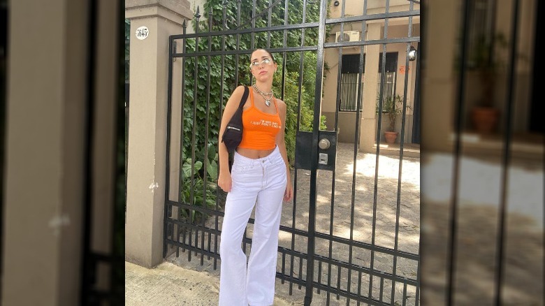 A girl wearing white jeans