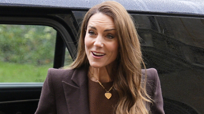 Kate Middleton wearing a gold heart necklace