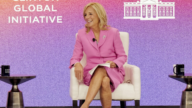 Jill Biden wearing all pink while sitting on stage