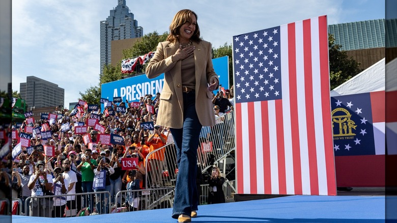 Kamala Harris at a campaign rally in jeans, a belt and a blazer