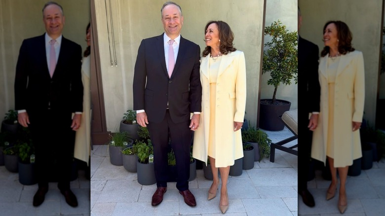 Kamala Harris in a yellow dress and coat next to Doug Emhoff