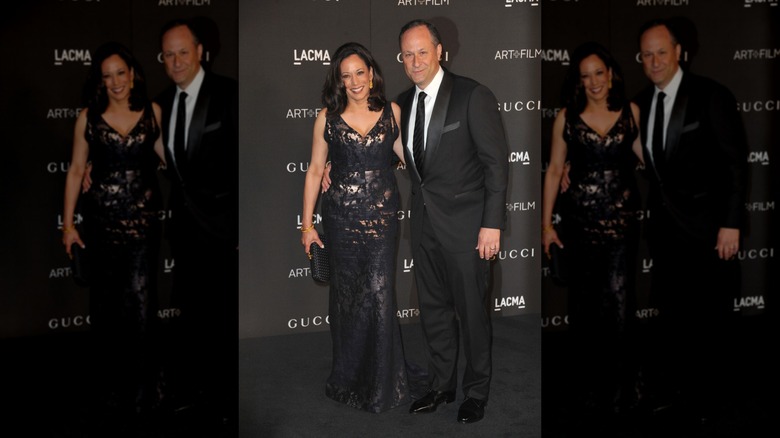 Kamala Harris and Doug Emhoff in black-tie attire - Kamala is wearing a metallic and black floor-length gown