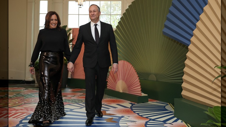 Kamala Harris in a sequin gold dress with Doug Emhoff