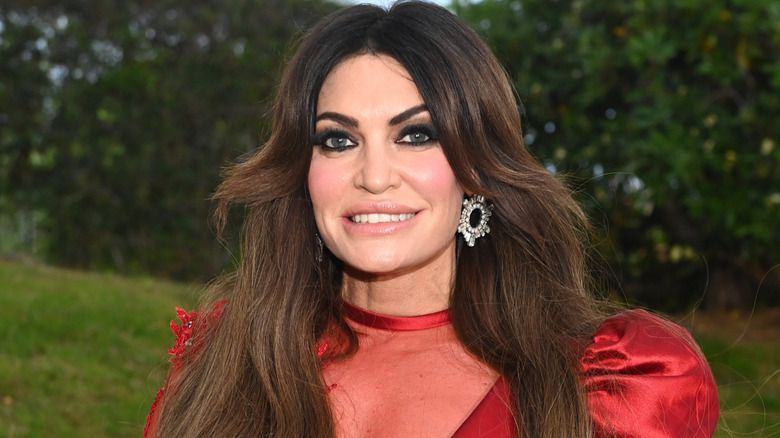 Closeup of Kimberly Guilfoyle posing in a red dress