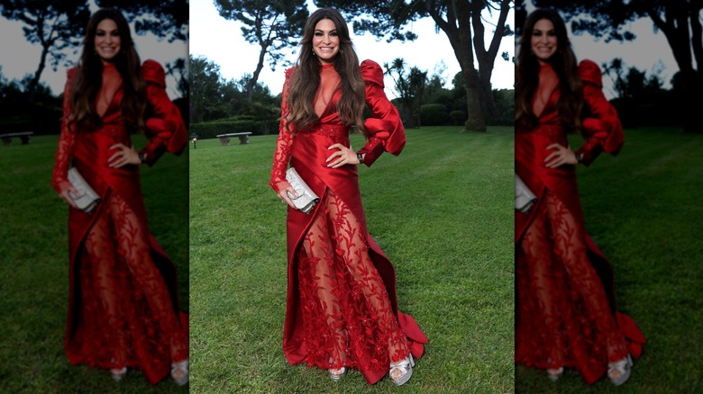 Kimberly Guilfoyle posing in a red dress
