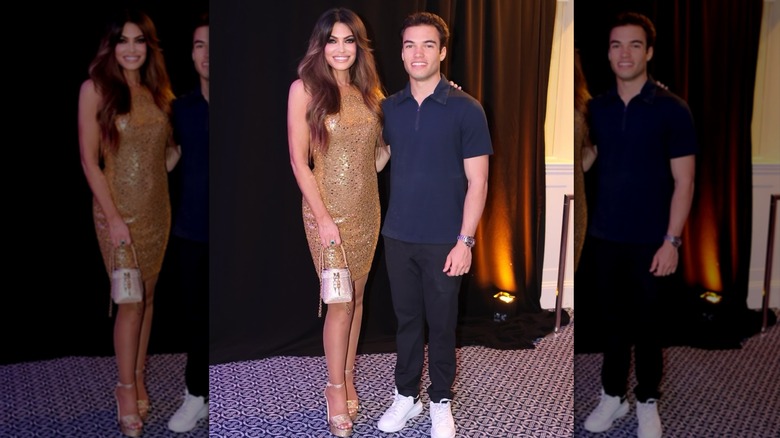 Kimberly Guilfoyle posing in a gold dress