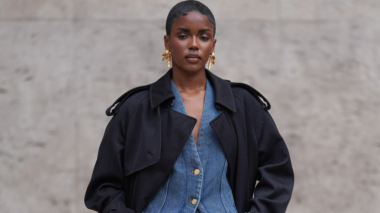 A guest at Milan fashion week wearing denim