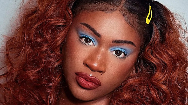 Woman in 1970s-style makeup