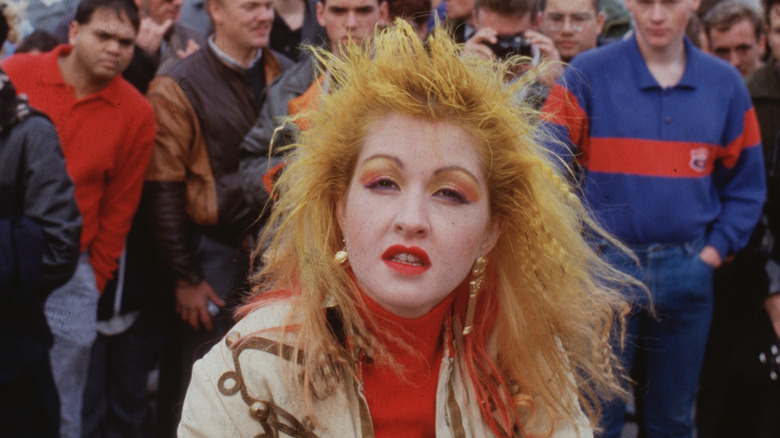Cyndi Lauper in crowd of men