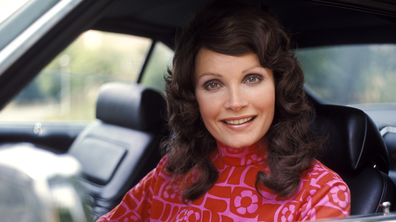 woman smiling in car