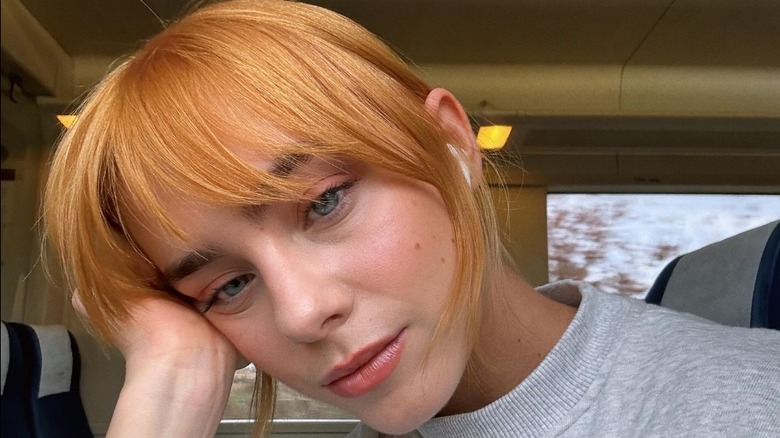 A woman with light copper hair