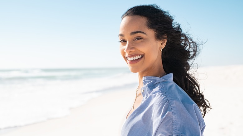 Woman smiling on the beach