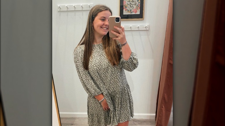 A woman wearing a drop-waist dress