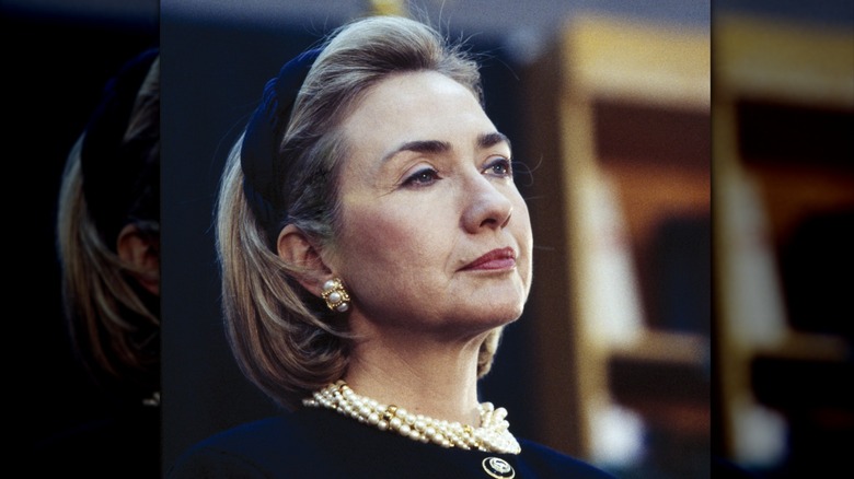 Hillary Clinton wearing a navy headband with pearls