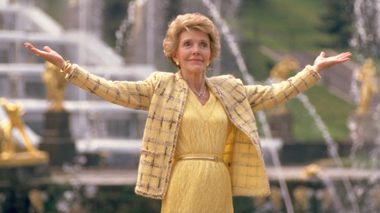 Nancy Reagan wearing a yellow dress with a tweed blazer