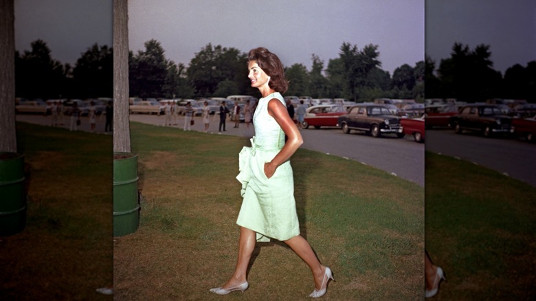 Jackie Kennedy Onassis wearing a mint shift dress.
