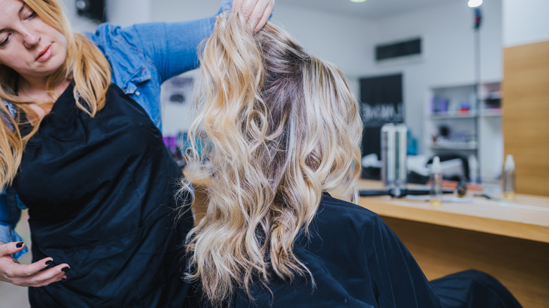 woman getting hair done