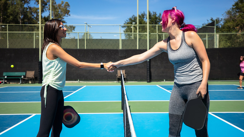 two women shaking hands