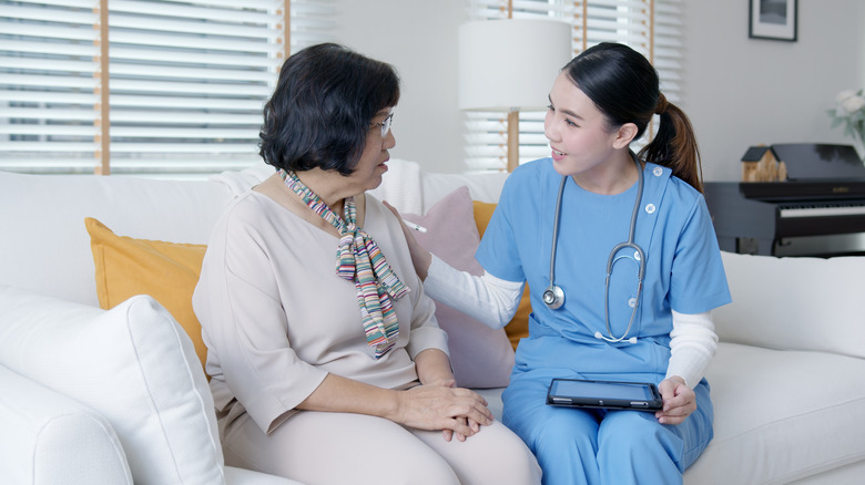 female home nurse with female patient