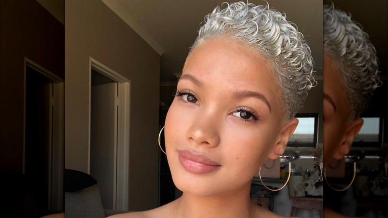 A woman with mini silver curls