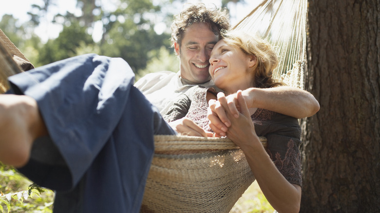 couple cuddling in hammock
