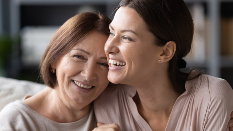 Mother and daughter hugging