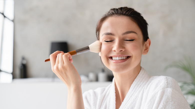Woman applying foundation