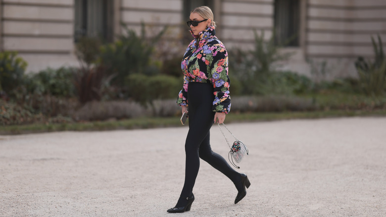 Person wearing black heels and leggings