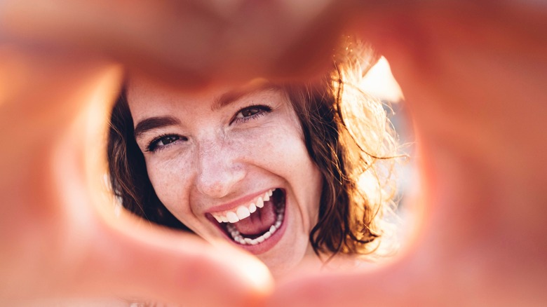 woman with heart hands