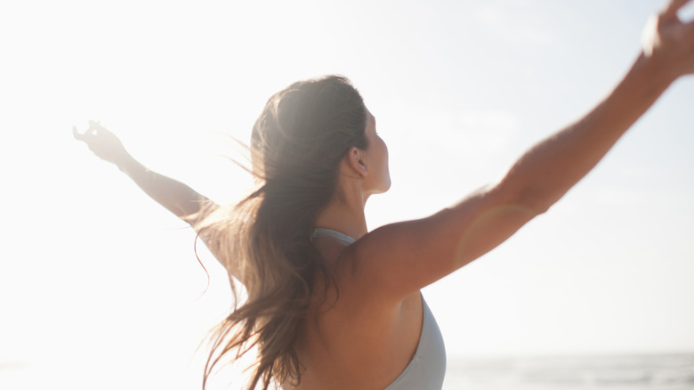 woman with hands out 