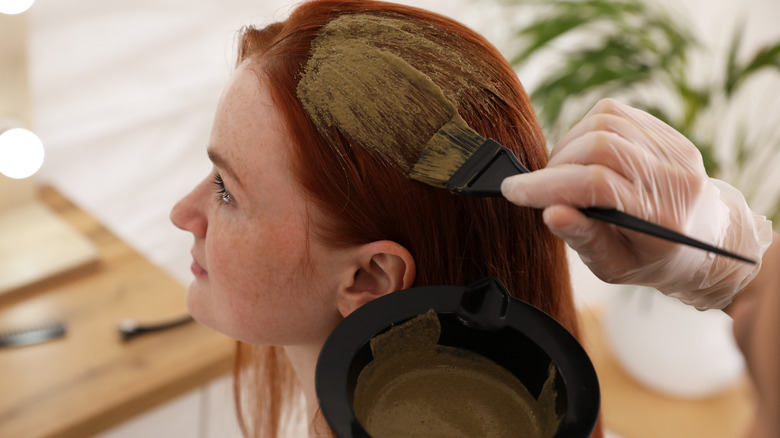 A woman getting her hair dyed