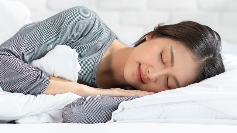 Woman sleeping on her side