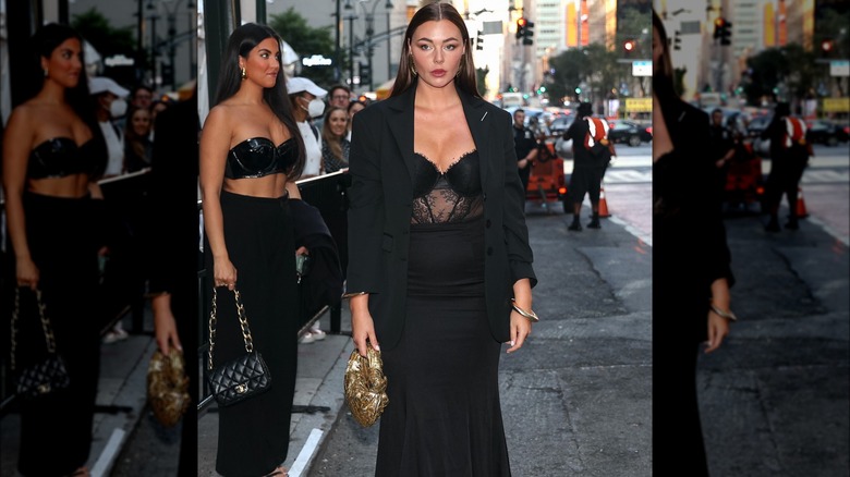 A woman in a black lace top