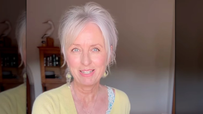 A woman with a bixie haircut.