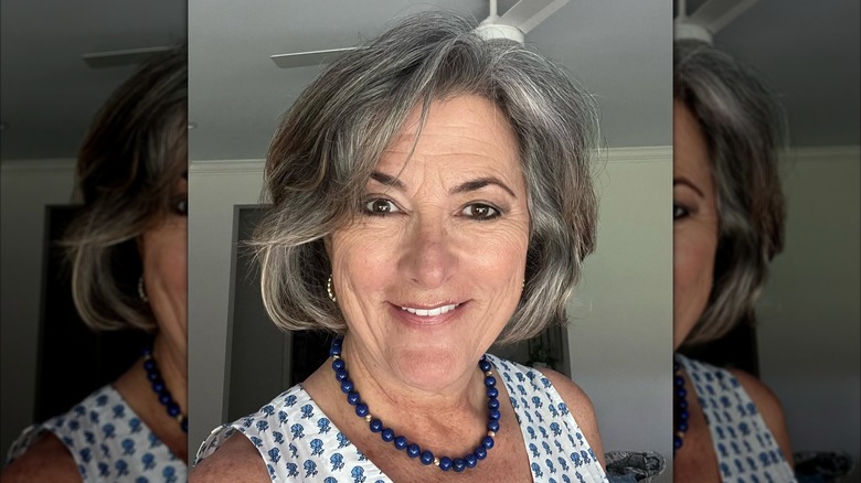 A woman with a layered bob haircut.