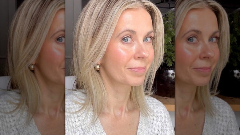 A woman with face-framing layers