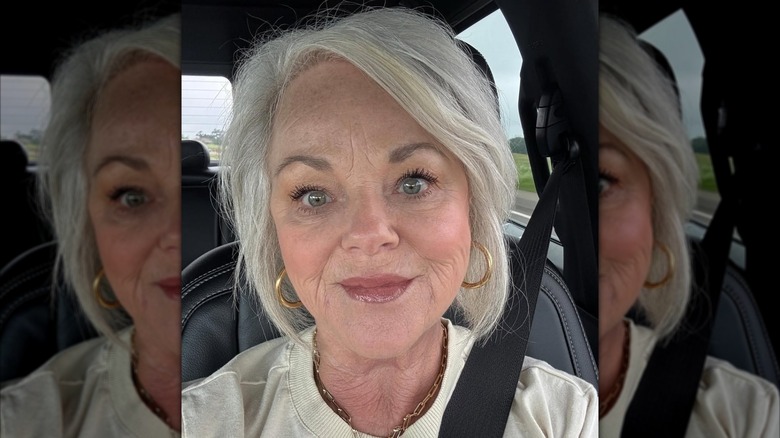 A woman with side swept bangs.