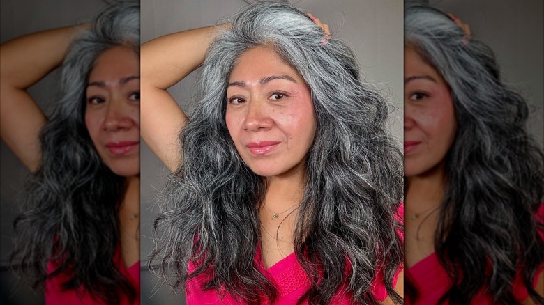 A woman with long layered hair.