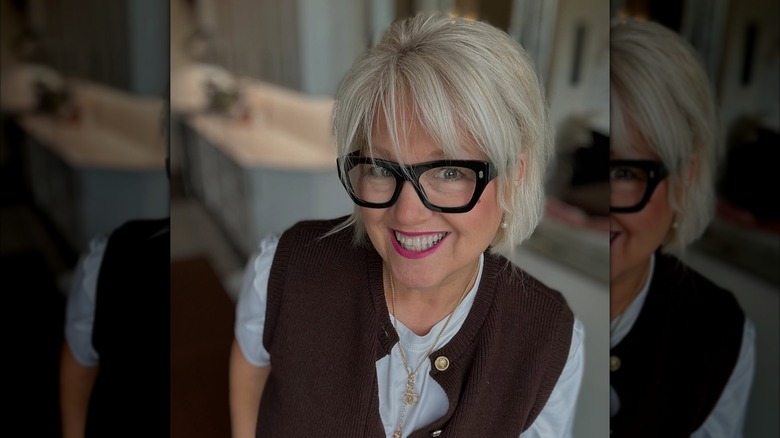 A woman with wispy bangs in her bob.