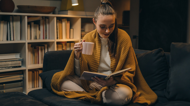 woman drinking coffee at night