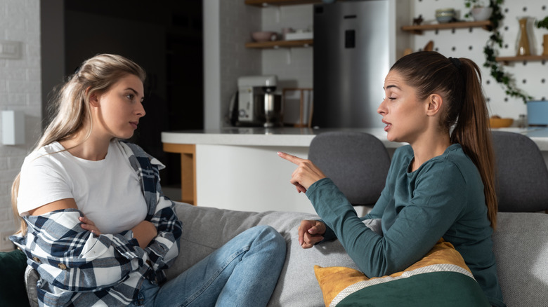 Two women talking to each other.