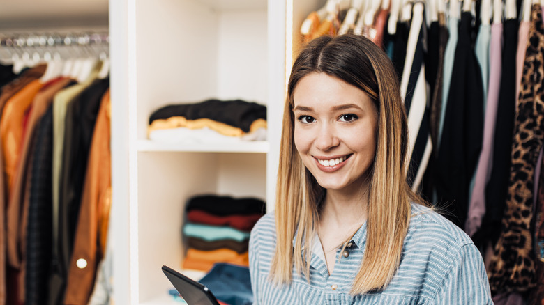woman taking inventory of her closet