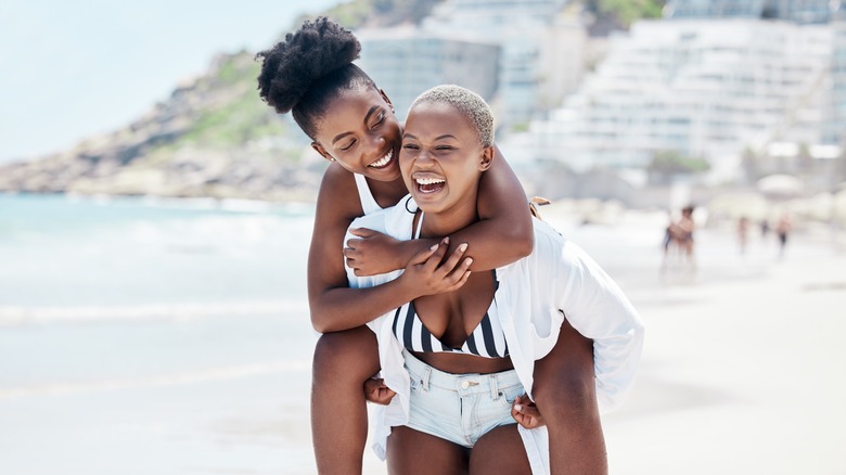 Smiling lesbian couple on vacation