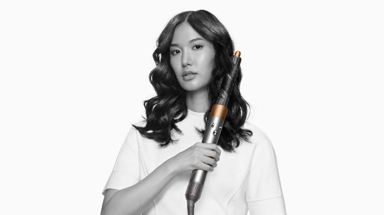 Woman using Dyson Airwrap