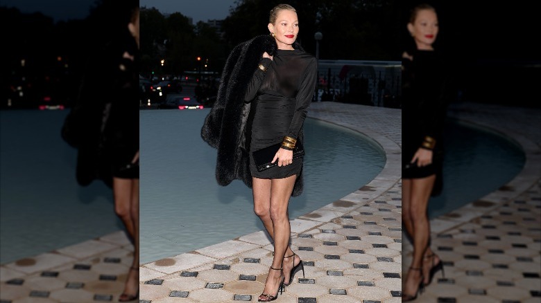 Kate Moss wearing a mini dress