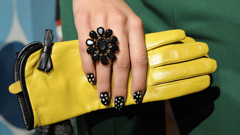 Woman cooking with gloves