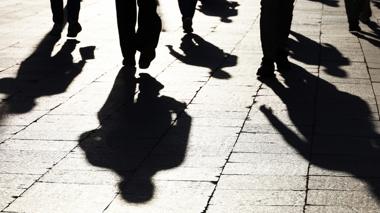 people casting shadows