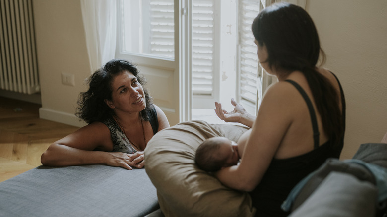 Mother getting advice from woman
