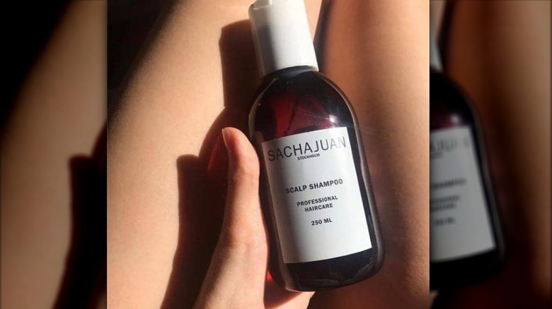 Amber colored bottle of shampoo